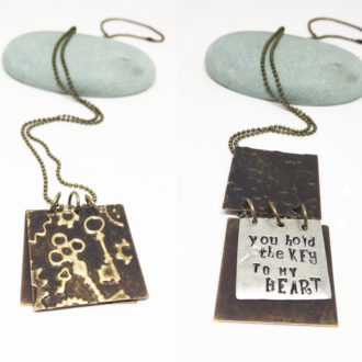 hand-stamped-key-to-my-heart-book-necklace-side-by-side