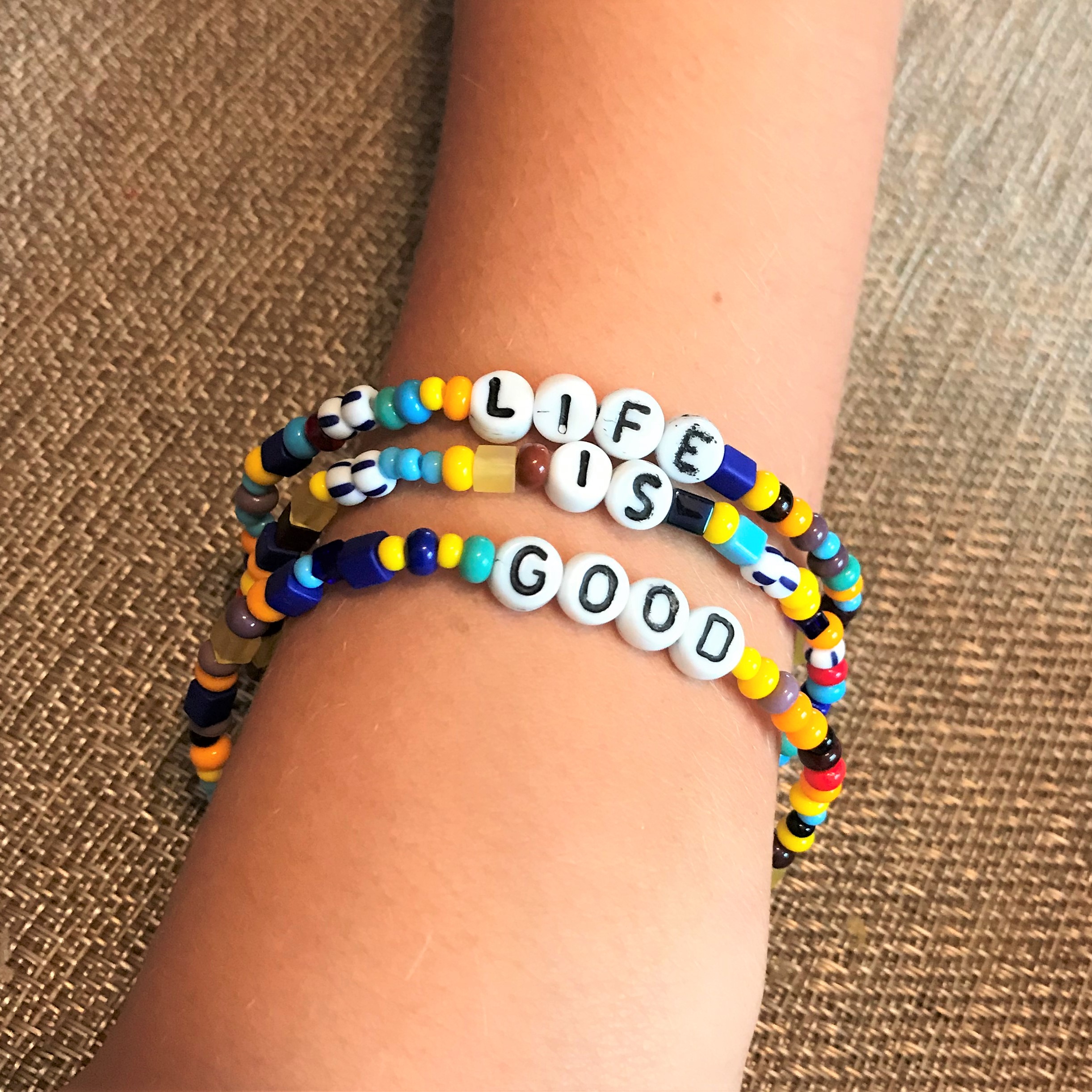 https://justbeadit.net/wp-content/uploads/2019/11/Bead-Camp-Bracelets-Rainbow-Bracelets-with-Words-or-Initials-Life-is-Good-3-Count.jpg