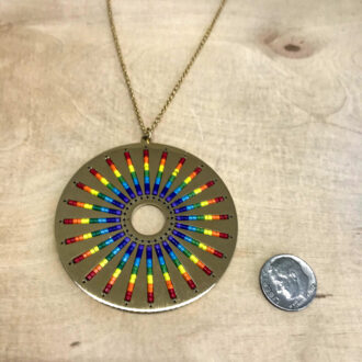 Rainbow-Pendant-Necklace-in-Gold-on-Natural