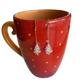 Clear Christmas Tree earrings on mug