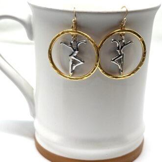 Gold and Silver Dancer Earrings on Mug